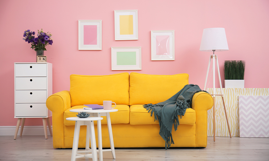 Modern pink living room with yellow sofa