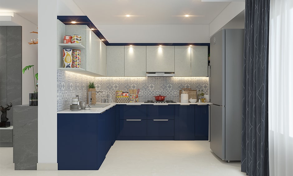 Navy blue kitchen cabinets creates sleek and stylish look in the kitchen interiors 