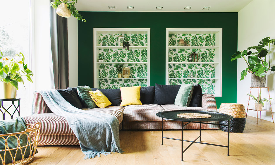 A big window with a solid grey curtain in the living room is the curtain to go with the green wall.