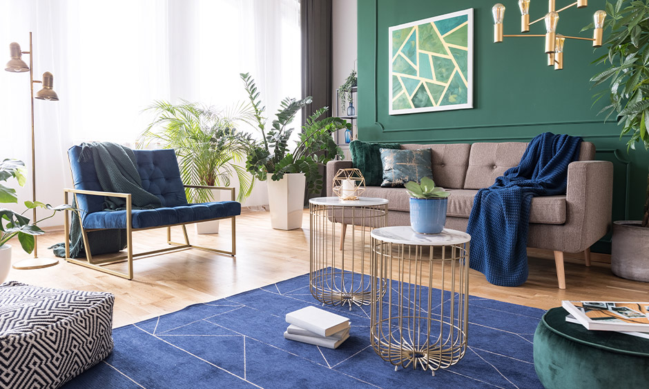 White and grey coloured curtains matching with green wall in the living room look playful.