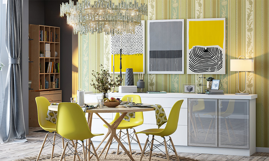 Dining area designed with a balance of bright yellow and matte grey pantone color of the year