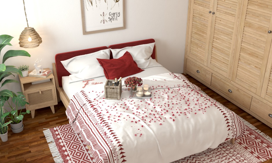 Ideal Valentine's day bedroom decoration ideas arrange flowers, wines, and candles on the bed