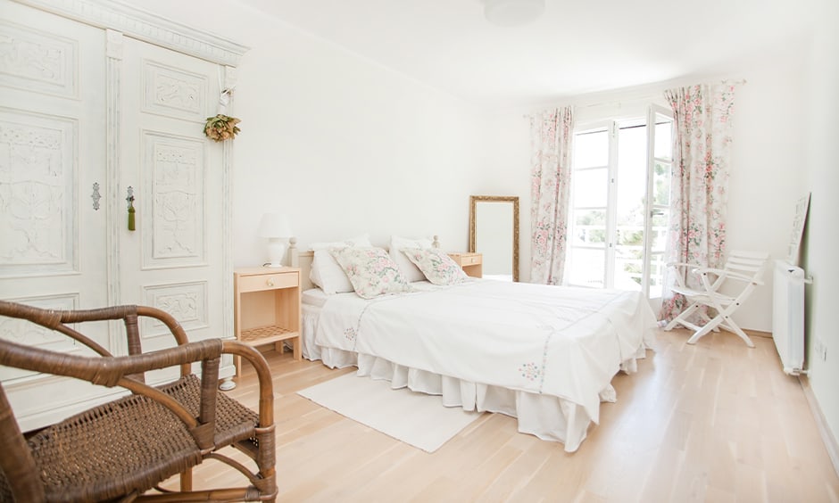 White bedroom cupboards giving a solid wooden look