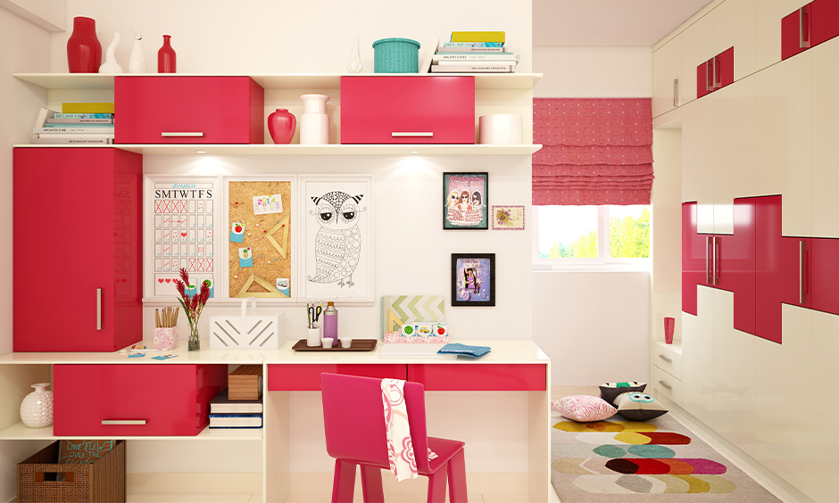 How to work from home with kids, White and pink combination workspace has bookshelves, table and chair elegantly designed.