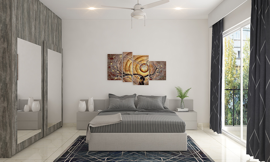 Gallery wall idea for bedroom with multiple artistic frames of different shapes and sizes