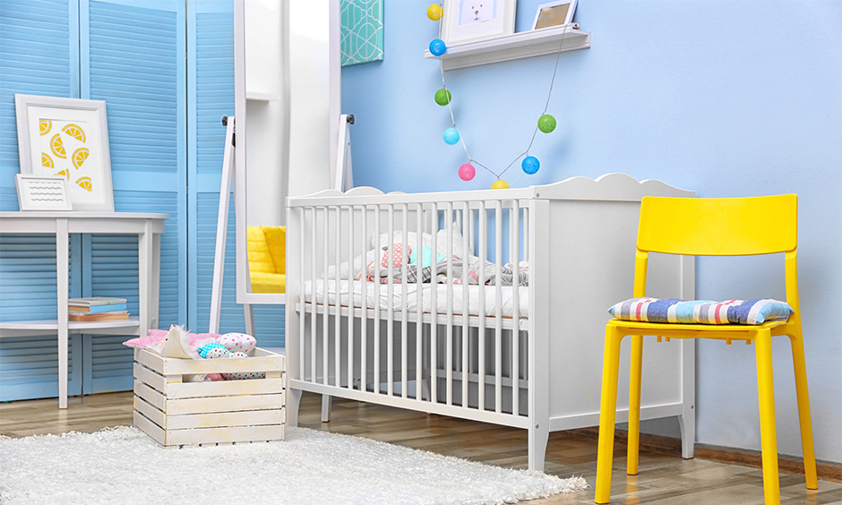 Baby room decor with a white crib