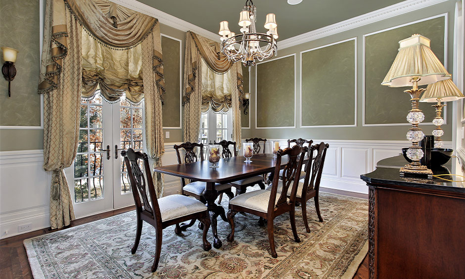 Dining room in classic french interior design with chandelier and fancy drapes