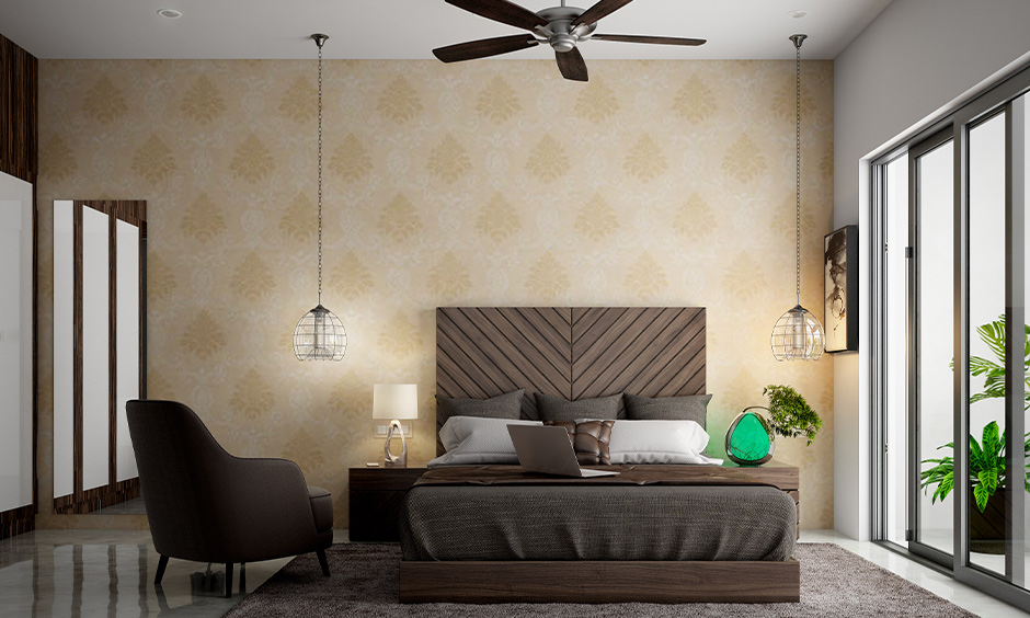 A large wooden headboard design with diagonal stripes design in a coffee-brown shade in the modern bedroom looks classy.