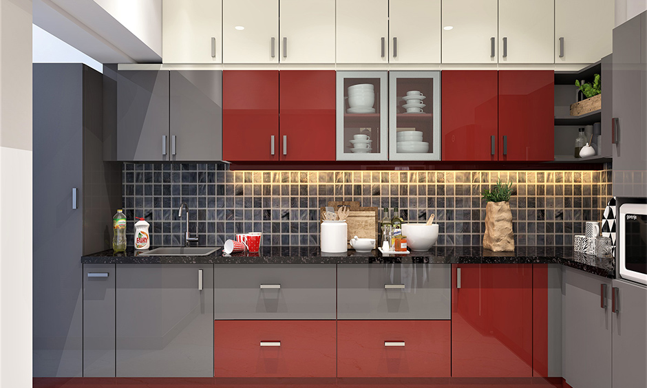 L-shaped kitchen crockery cabinet covered in glass with plates and bowls placed inside it.