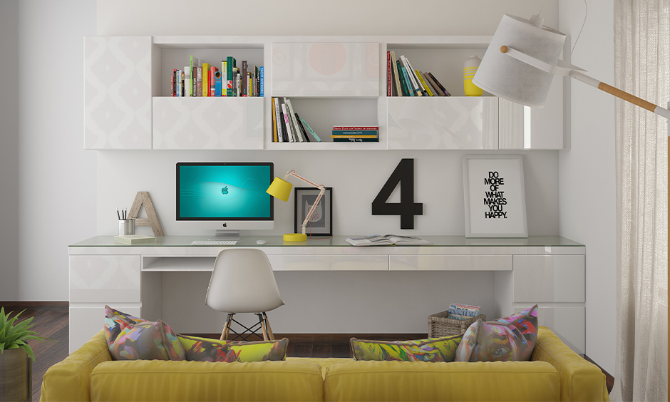 A workspace in white colour with storage shelves, table and chair sleek design, working from home with kids.