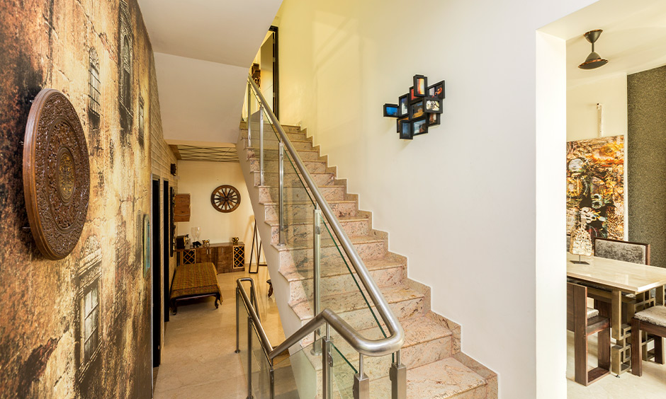 Marble stairs and glass railing designed inside the home look elegant is the stairs marble design in India.