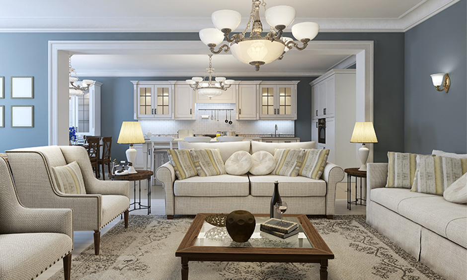 Grey and white home colour matching in the living room with a beige fabric sofa set look classic.