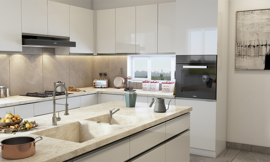 The integrated double-bowl kitchen sink with marble top in the white island kitchen is multi-functional.