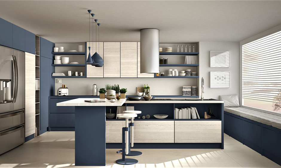 Kitchen crockery cabinet, Island kitchen in navy blue and off-white themed with open crockery shelves look luxurious.