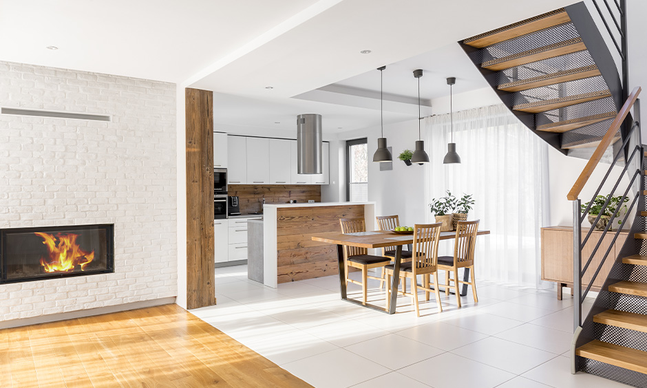 White floor tiles design, kitchen cum dining area has white limestone floor tiles sleek and stunning look.