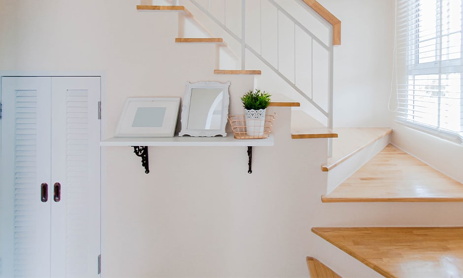 Simple staircase wall decor with open shelf