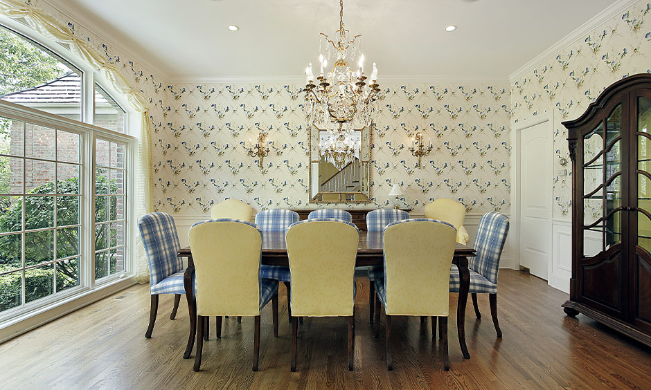 Dining room in pastel yellow and blue is a beautiful colour combination for home with a chandelier