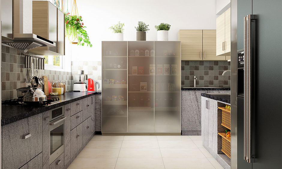 A tall kitchen cabinet storage idea with a translucent glass door