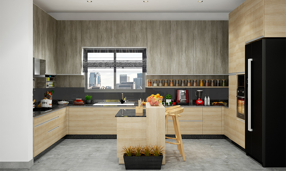 U-shaped kitchen island with granite countertop and two wooden stools