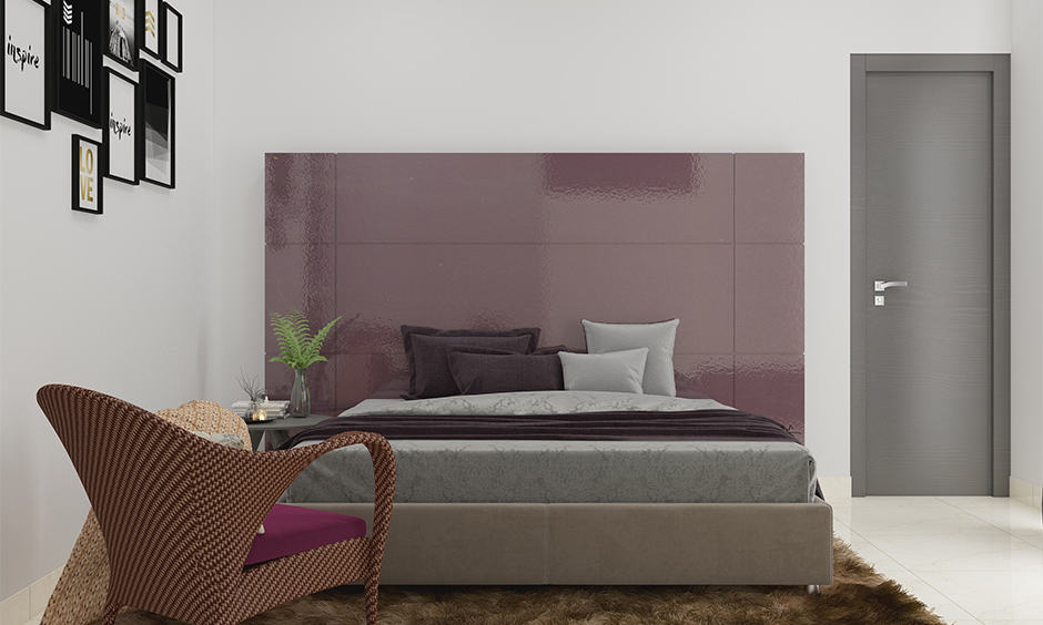 Violet in colour combination for bedroom according to vastu with a patterned wallpaper