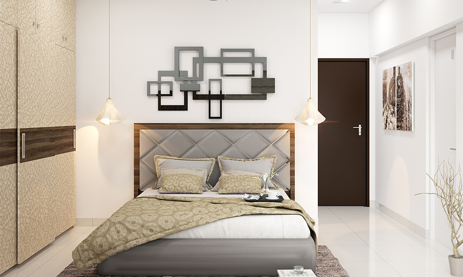 wooden headboard designs frame with the tufted upholstered middle in grey colour lends a glam look.