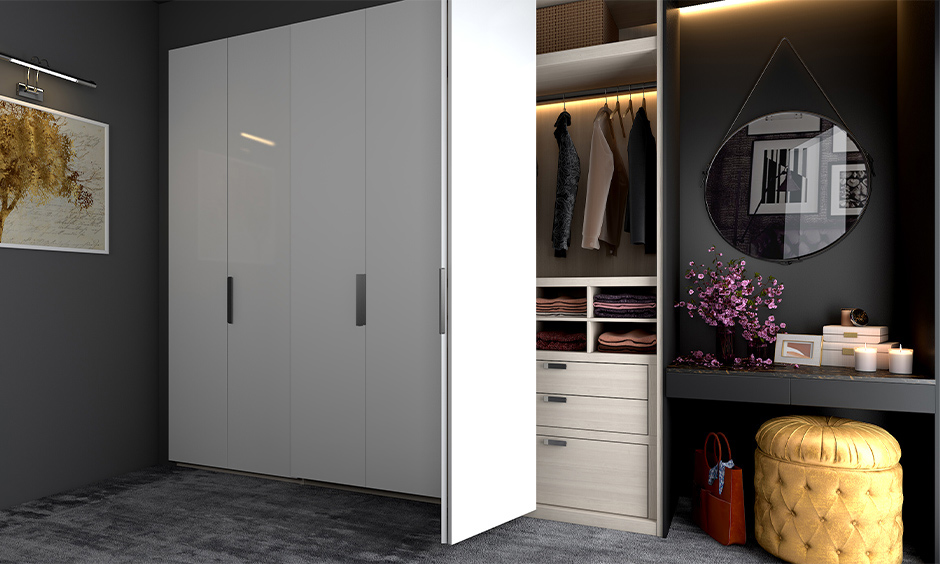 Mother's day wardrobe design, A clutter-free wardrobe with concealed dressing units in the bedroom lends an aesthetic look.