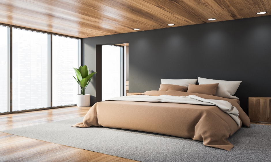 Minimalistic bedroom wooden flooring and ceiling lends a modern look and is the best wooden flooring for the bedroom.