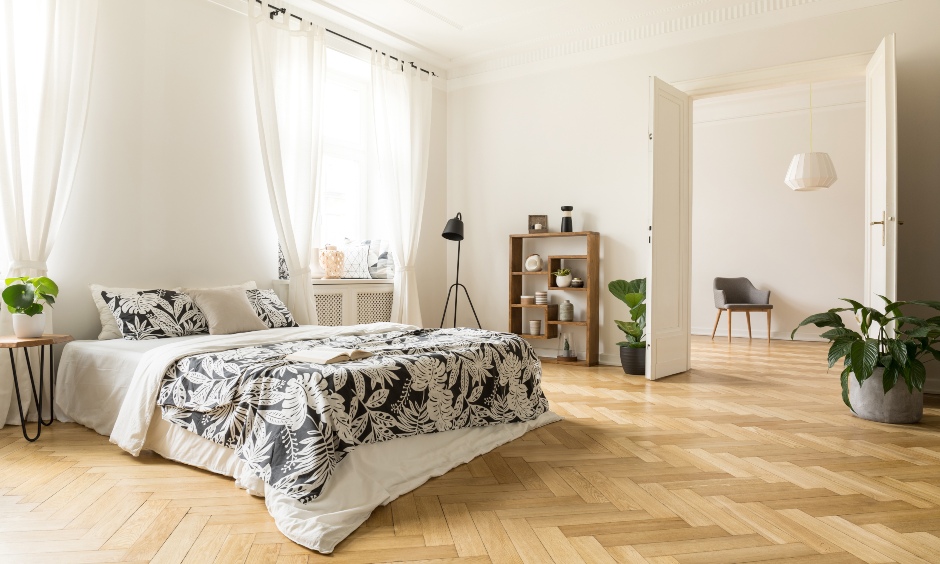 Bohemian white bedroom wooden flooring in a chevron pattern and made from bamboo is a chic design.