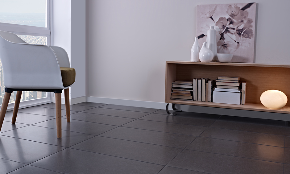 Types of tiles in India- grey ceramic tiles with a smooth finish lends a minimal look to the area.