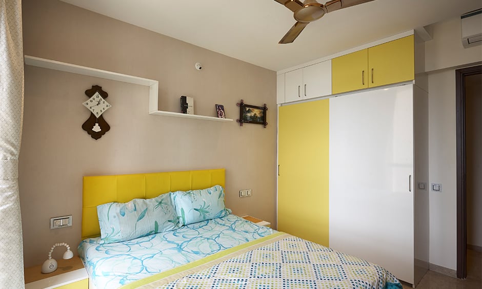 Contemporary middle-class indian bedroom design with a modular furniture and a comfortable bed