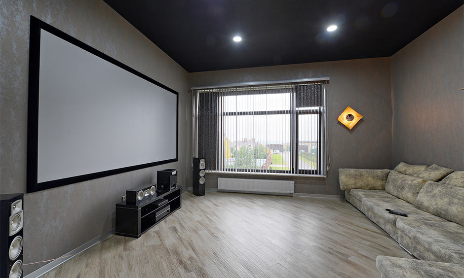 Dark home theatre ceiling design with basic lighting