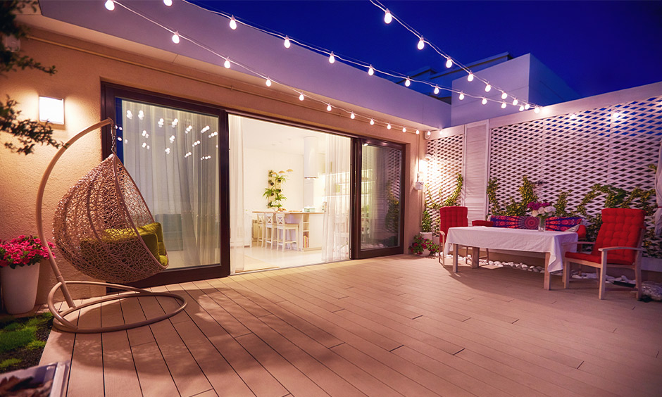 A sliding glass door design with the wooden frame between the patio and living area acts as a beautiful partition.