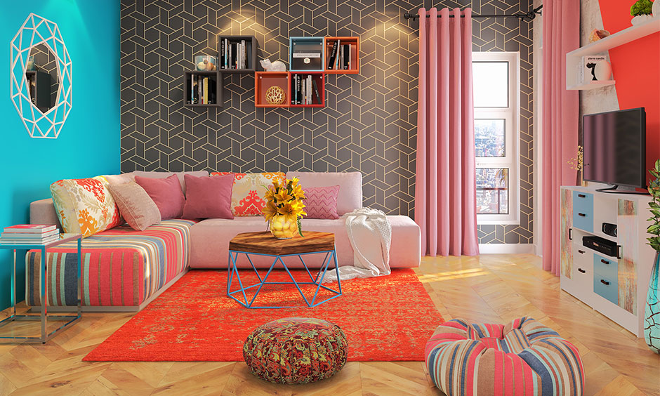 Laminate wood flooring in a herringbone pattern in the colourful living room adds a playful vibe.