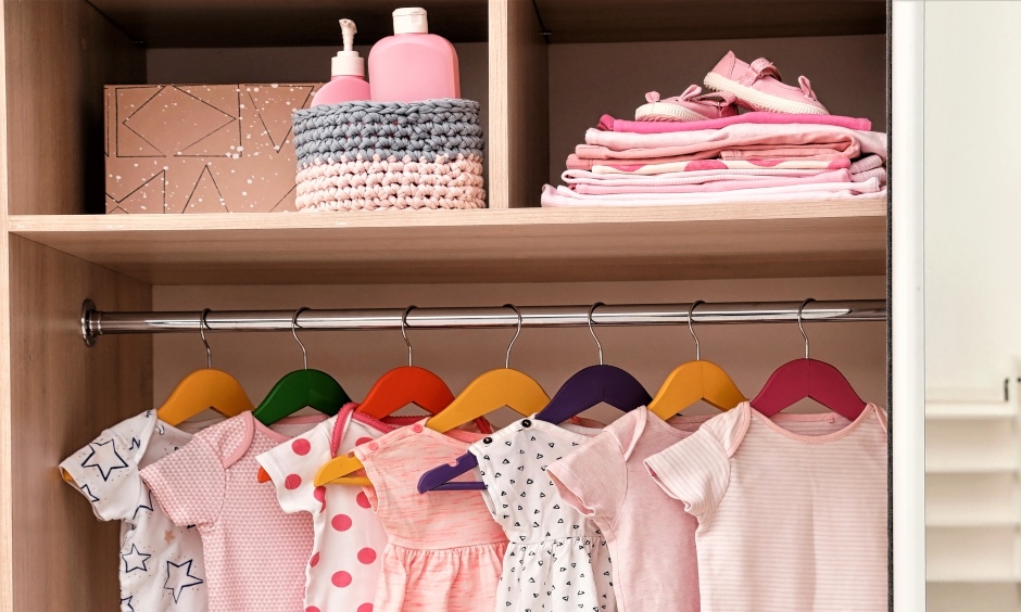 How to organize wardrobe for baby's- sliding door wardrobe with a hanging rod and compartments is elegant design.