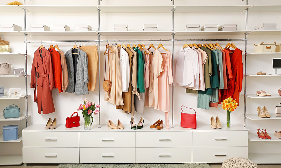 How to organise wardrobe for women's- A freestanding clothing rack and wooden crates are perfect for organising and access.