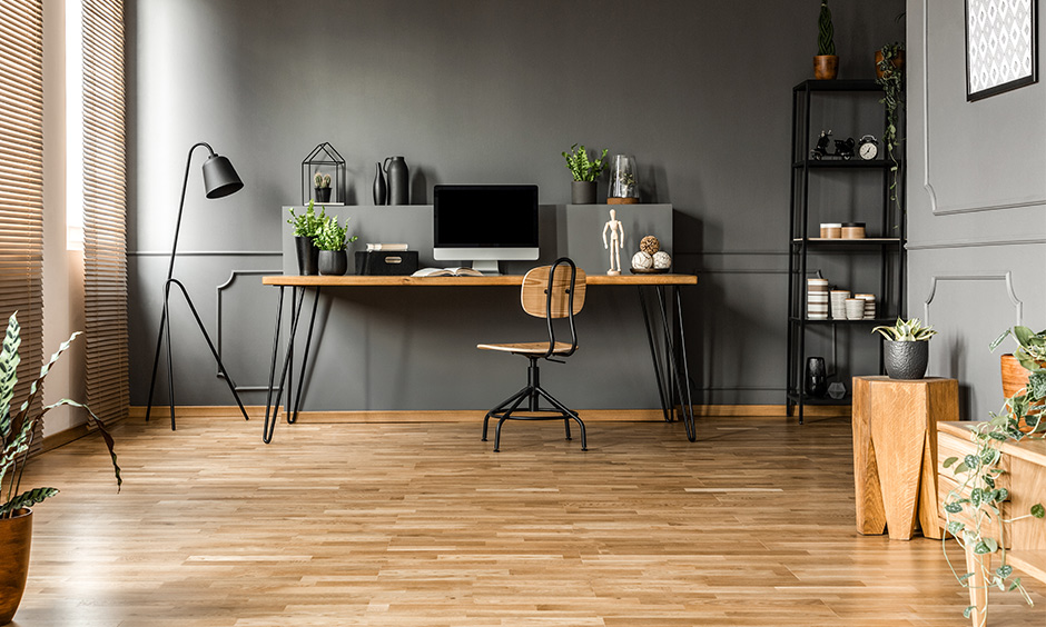 Study room decoration in industrial and natural style with wooden flooring, metal rack and black metal floor lamp.