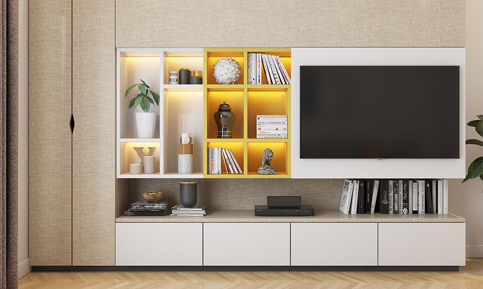 Wooden tv showcase design for hall with sunmica laminates and backlighting enhances the beauty of its design.