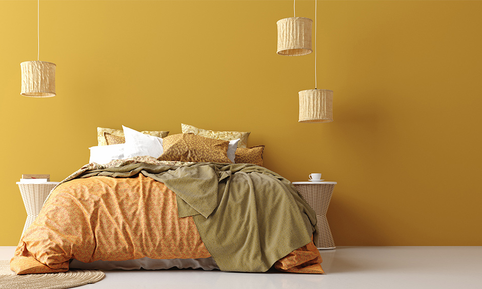 Marigold summer bedroom color with white flooring tiles in minimalist design lends an elegant look.