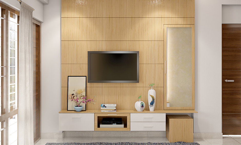 Minimal wall fitted dressing table design with tv unit attached looks minimalistic in the bedroom.