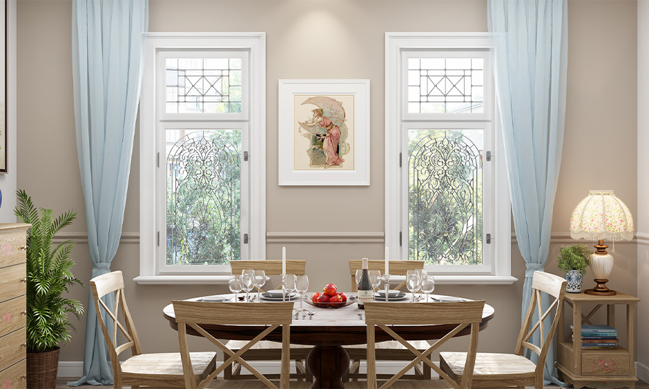 The dining room has a modern popular window grill design in floral with an industrial look