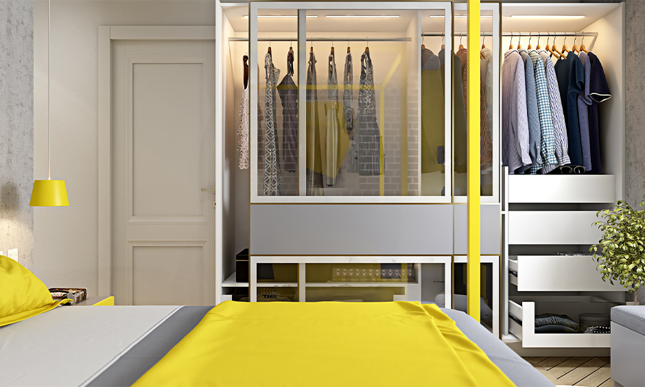 A wardrobe with a modern sliding glass door design in the bedroom lends a luxurious look to space.