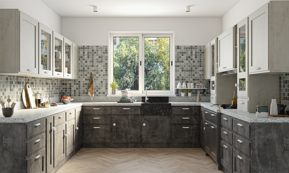 U-shaped kitchen cabinet in multiple grey-coloured shades looks sleek and is the 2021 kitchen cabinet color trend.