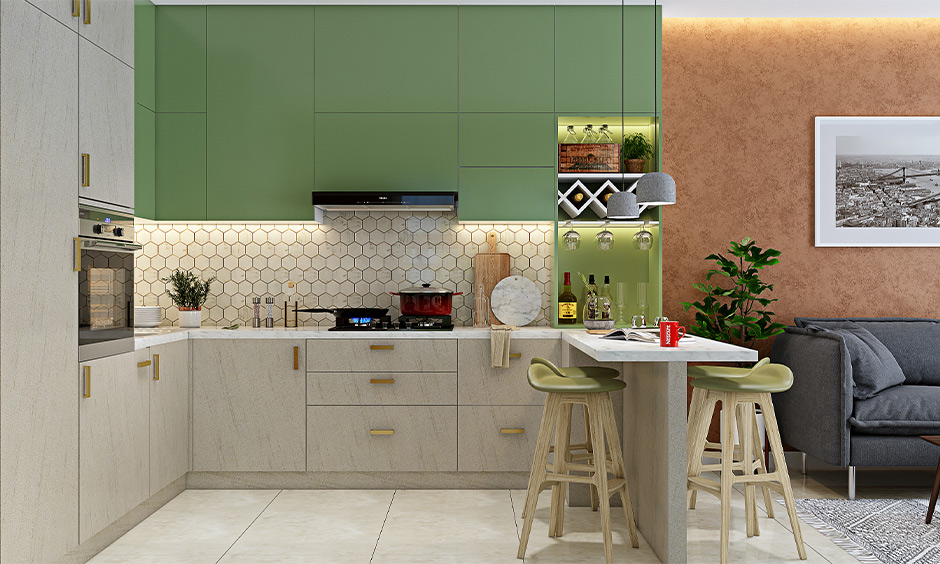 Open kitchen design Indian style with breakfast counter, clutter-free storage and display space.