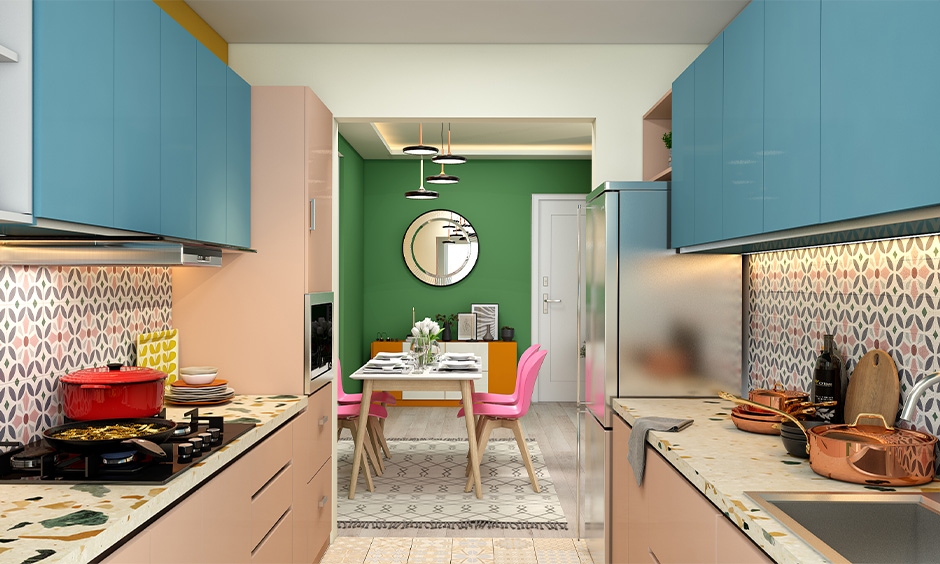 Small parallel kitchen cabinet color trend in 2021 in pink and blue combination looks spacious and chic.