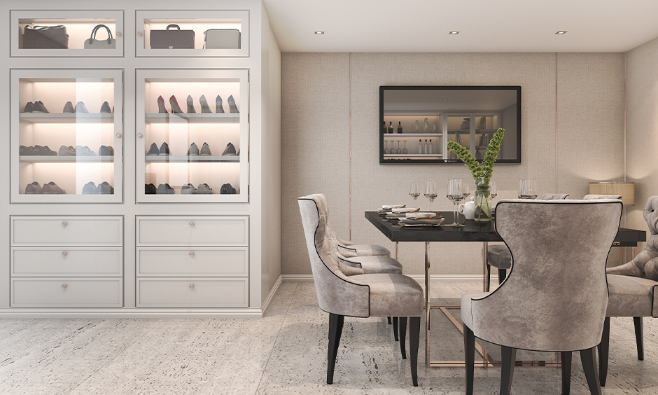 A white space-saving shoe storage rack with a glass door and backlights in the dining room lends a classic look.