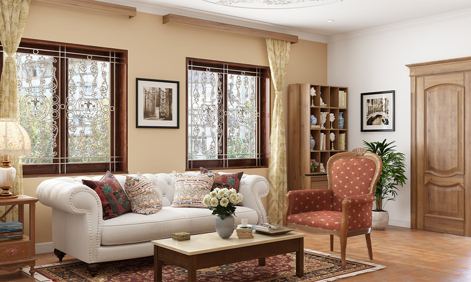 Living room with stainless steel modern window grill design in floral gives the Indian touch to space