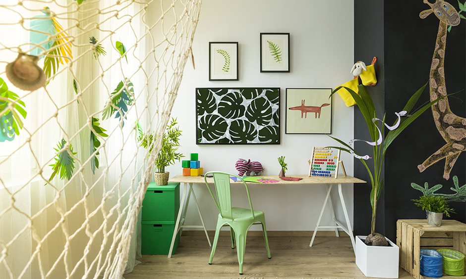 Study room decoration idea, study room decorated with paint art frames, green plants and wall arts bring a natural calmness.