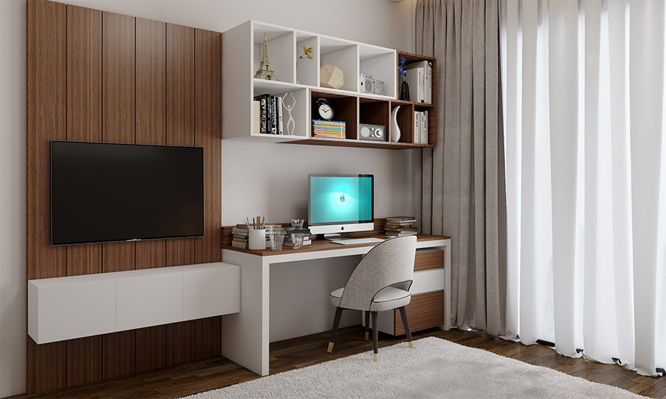 Study room decoration in white and earthy wooden tones add a calming effect with a floating open shelf and tv unit.