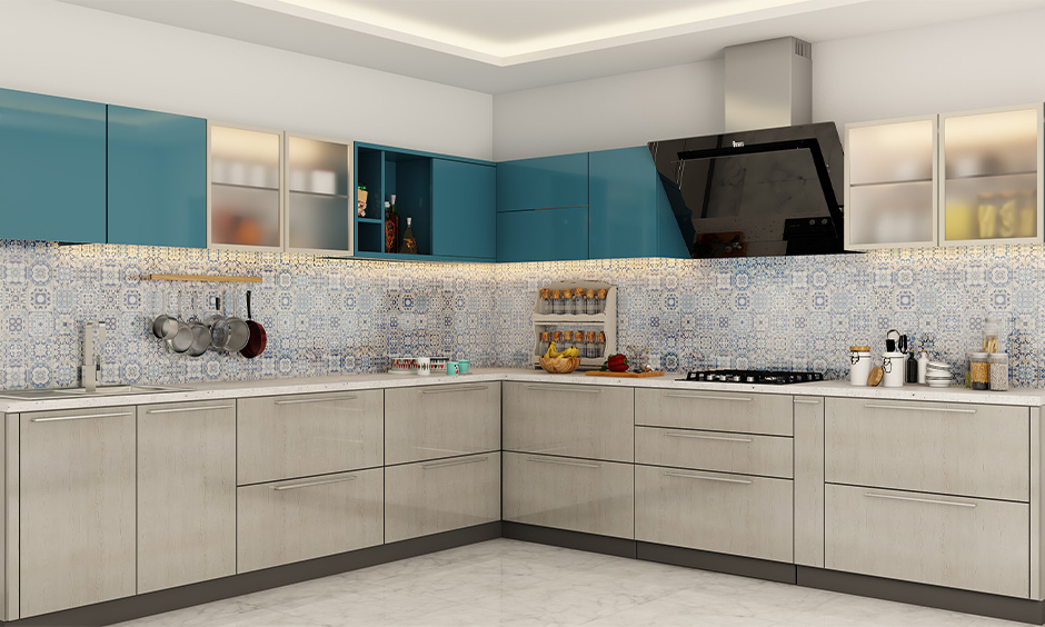 L-shaped kitchen cabinet color trend in 2021 in teal and grey combination looks extremely elegant.