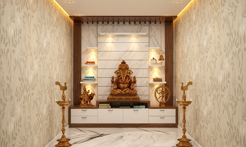 Marble pooja mandir design for home with intricate carvings and motifs enhance the look of the area.